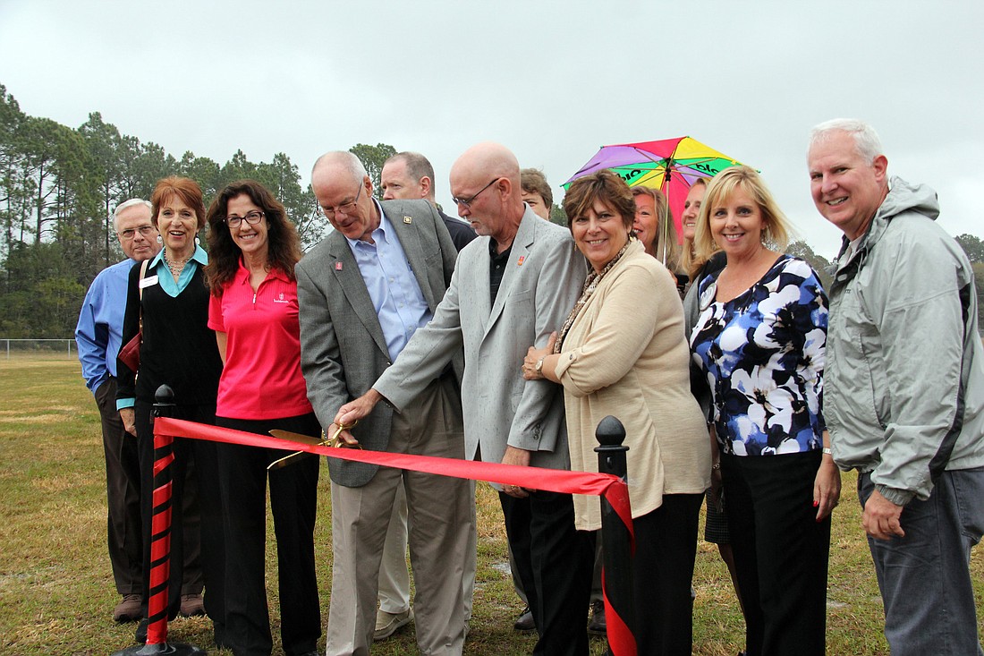 Members of the Rotary Club of Flagler Beach cut the ribbon on the new Rotary Sports Fields on E. Drain St. in Bunnell.