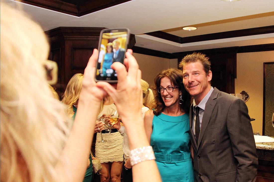 Reality TV star Ty Pennington poses for a picture with Roseanne Stocker Saturday night at the Hard Hats and High Heels gala.