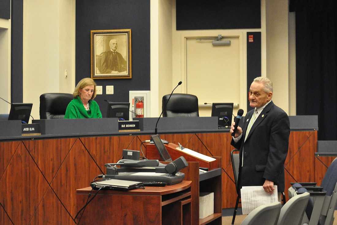 Former School Board member John Fischer urged the board not to approve the proposed change. (Photo by Jonathan Simmons.)