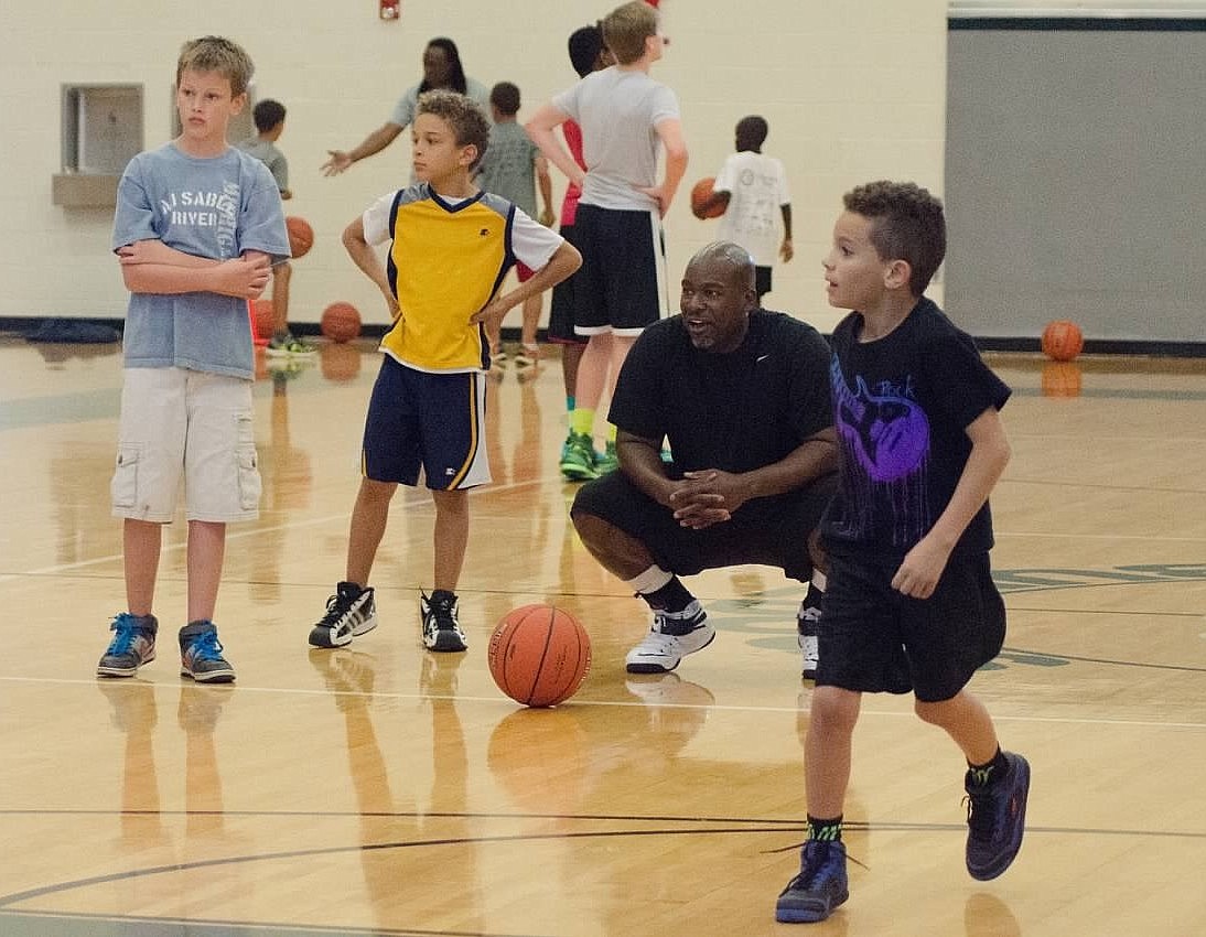 Michael Steward supervises the kids as they go through dribbling drills.