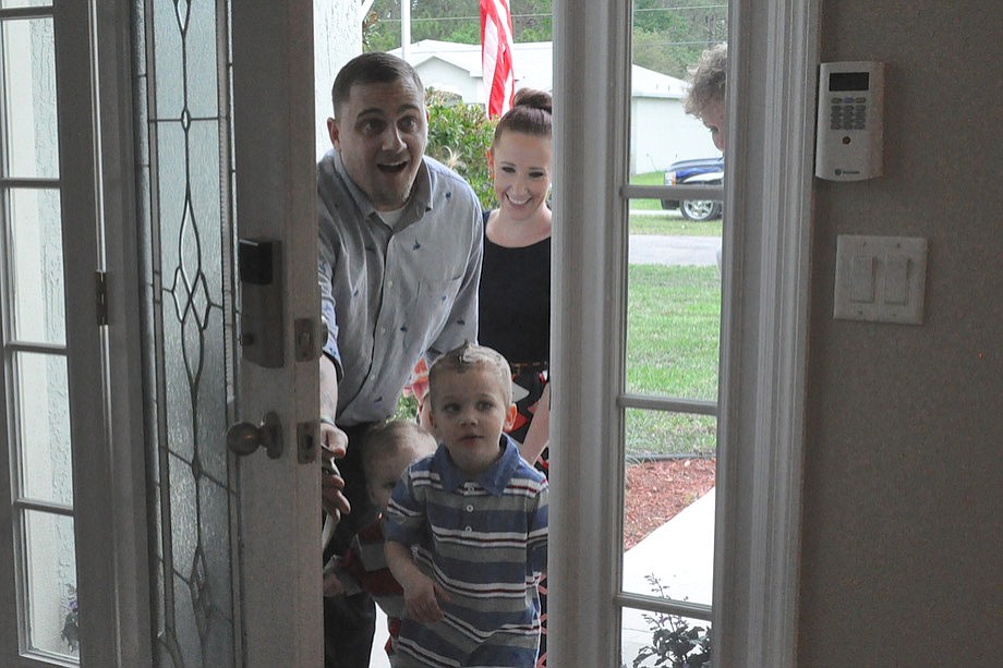 Kevin Sosa, his wife Kendra, and their sons Karter and Kaithan get their first glimpse of their new homeÃ¢â‚¬â„¢s post-renovation interior. (Photo by Jonathan Simmons.)