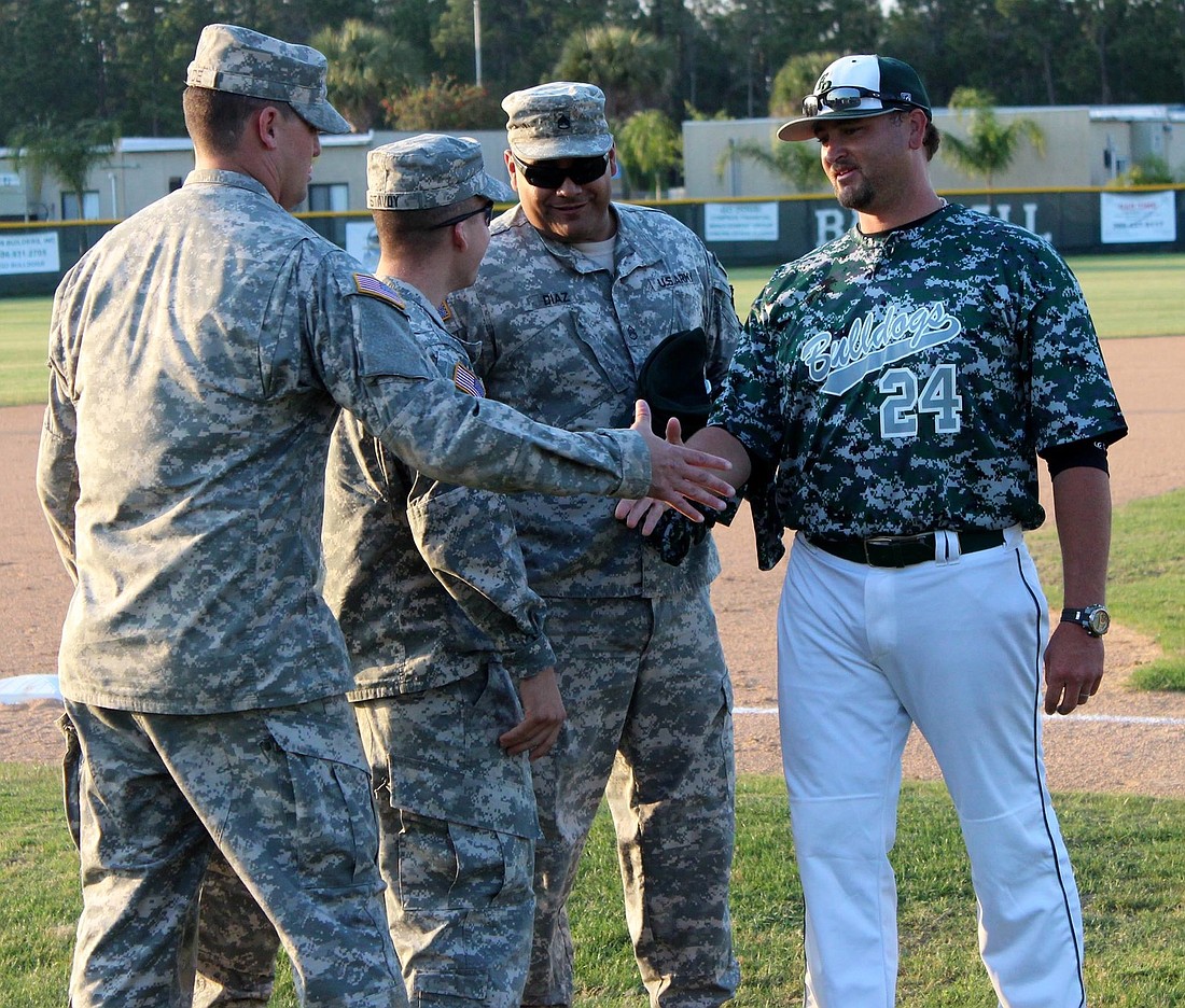 Coach Jordan Butler provided the soldiers with jerseys and hats on Military Appreciation Night.