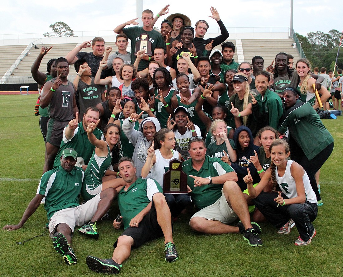 FPC boys and girls flood the podium as District 4A-1 champions together.