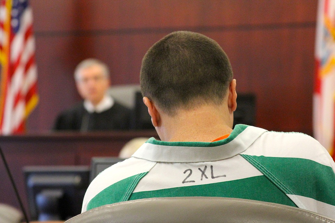 William Gregory prepares to listen to the appeal hearing, with Judge David Walsh in the background.