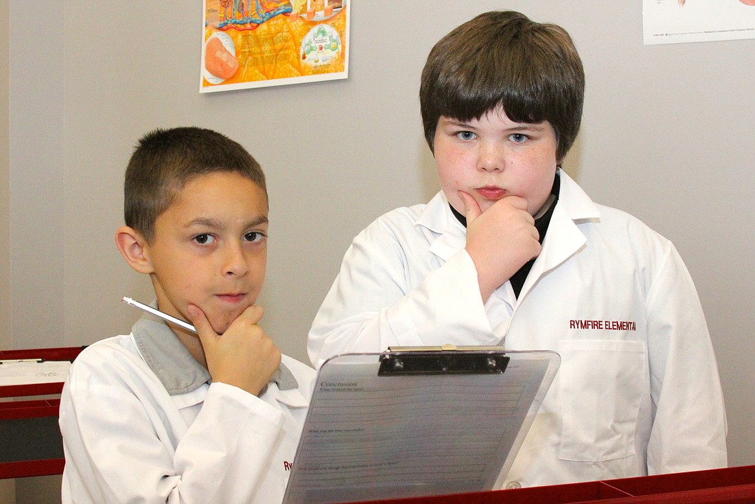 William Draper, 11, and Jonathan Crawley, 10, put on their best Ã¢‚¬Å“scientistÃ¢‚¬ faces.