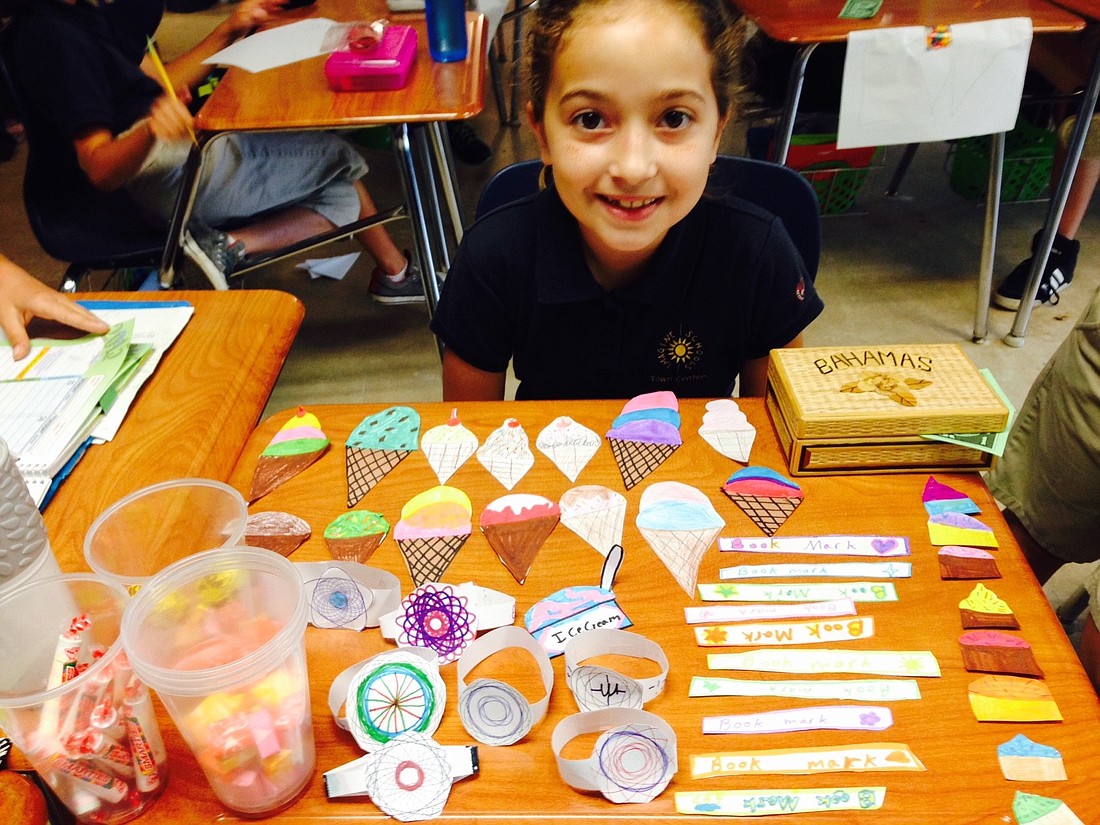 Third grade student, Annalise Roman, sets up her store with many different items to sell.
