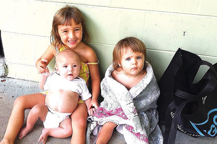 Madison, 5, Elizabeth, 2, and Landon, 11 months, were all injured in the fire, months after this photo was taken of them on a camping trip. (Photo courtesy of Jamie Kuykendall.)