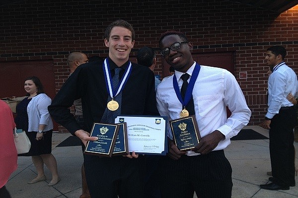 William Conville and Jeffrey Simon hold their awards after the ceremony on Wednesday evening.