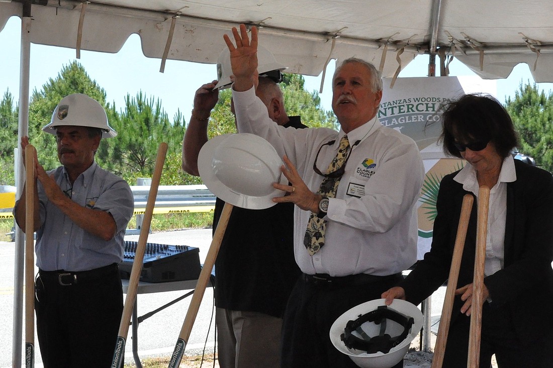 County Commissioners George Hanns, Frank Meeker and Barbara Revels at a May 18 groundbreaking for the Matanzas Woods Parkway and Interstate 95 interchange. (Photo by Jonathan Simmons.)