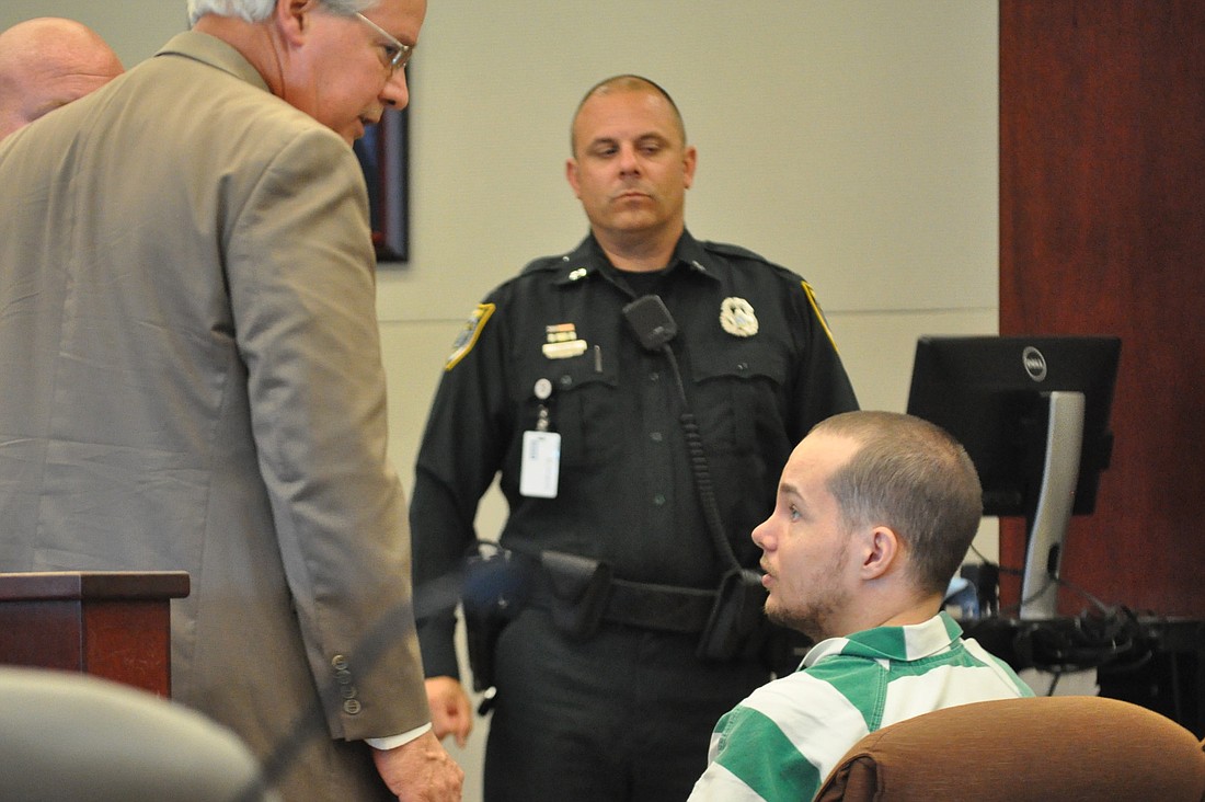 Joseph Frank Bova speaks to attorney Raymond Warren at a May 29 competency hearing. (Photo by Jonathan Simmons.)