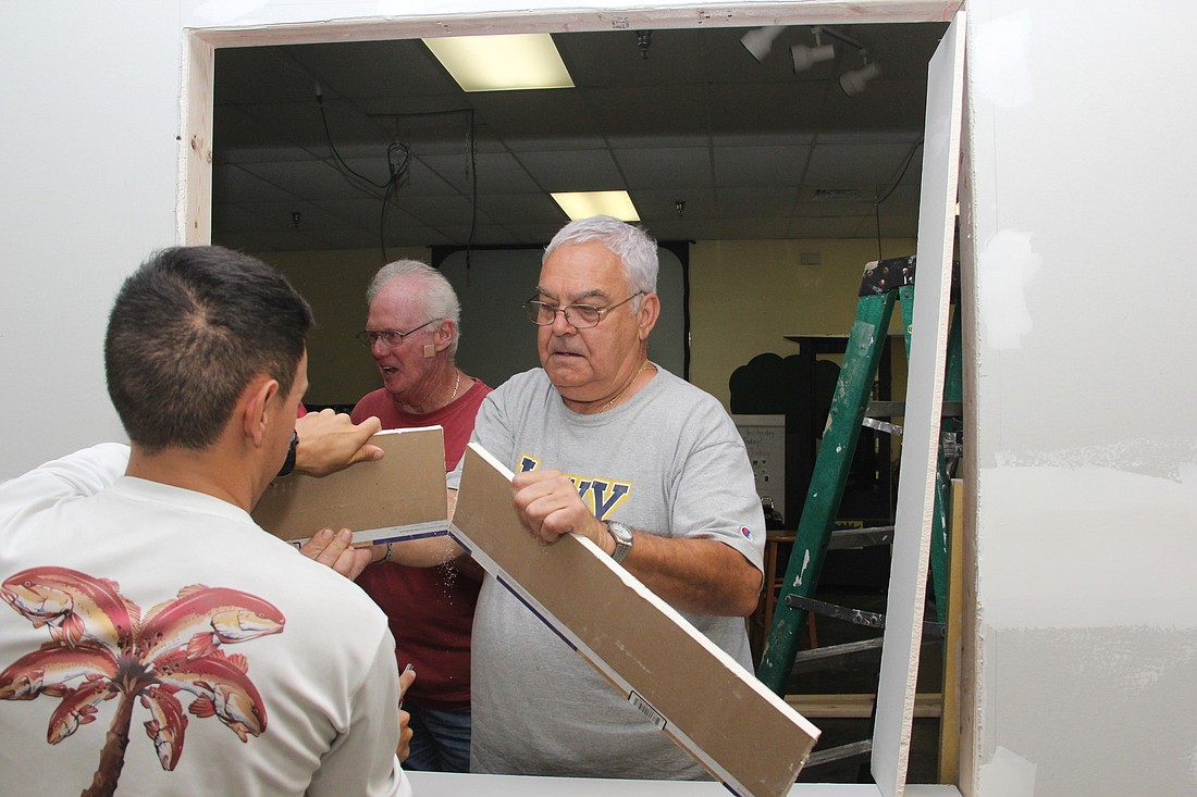 Nick Maiorino works with other volunteers to bring the clubhouse to life.