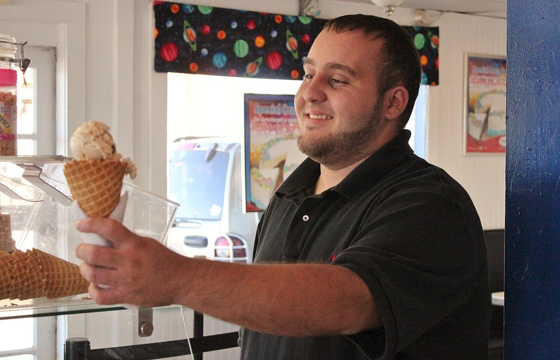 Kenneth Leandro, a college student, owns Planet Ice Cream.