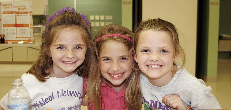Six-year-old Lexi Kahler and her sister Madison, 8, along with their 8-year-old friend Tammy Sinn-Movilla, middle, celebrated their Pa's 67th birthday during Bingo Night March 18.