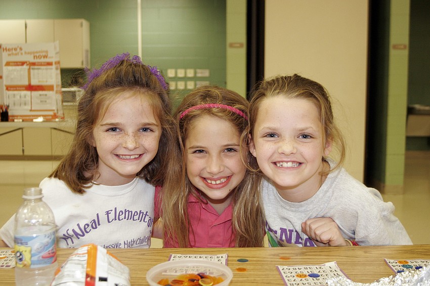 Six-year-old Lexi Kahler and her sister Madison, 8, along with their 8-year-old friend Tammy Sinn-Movilla, middle, celebrated their Pa's 67th birthday during Bingo Night March 18.