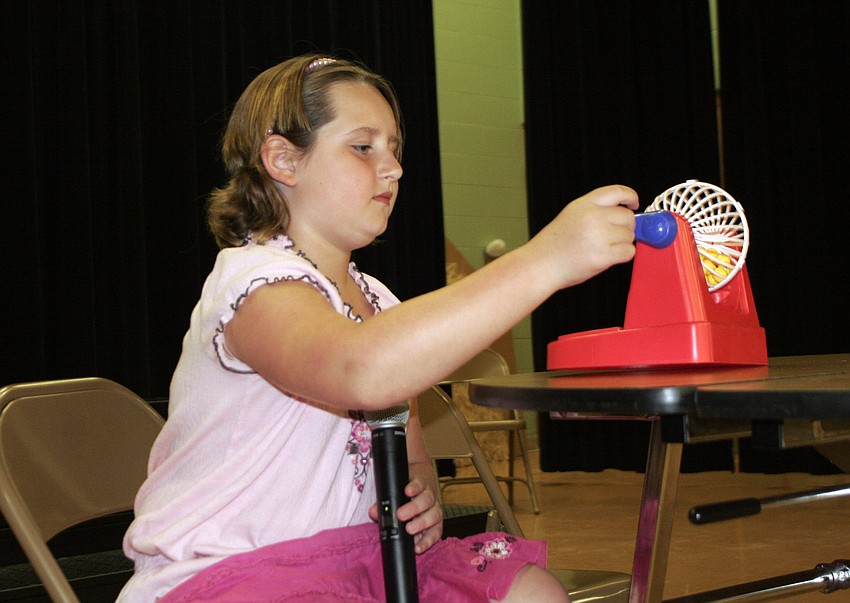Nine-year-old Olivia McNeal served as the Bingo caller.