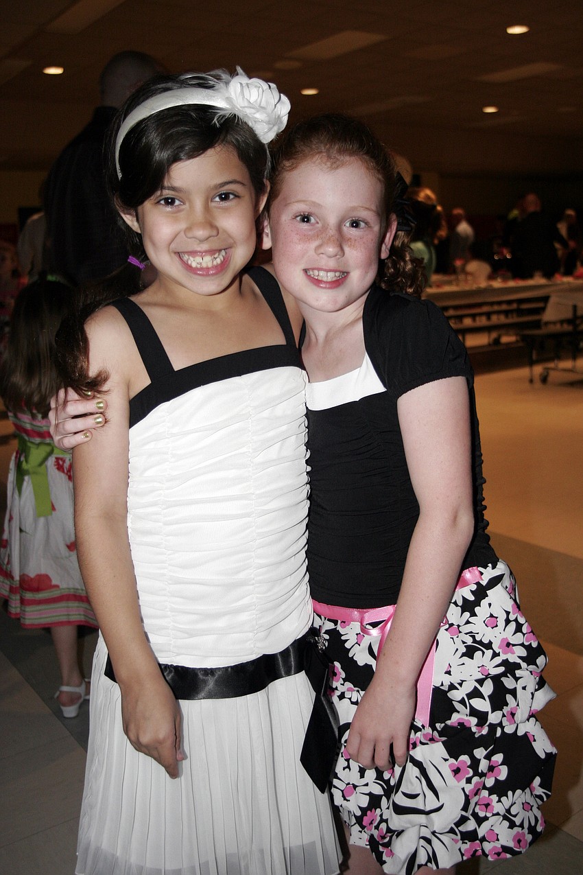 Nicole Pritchard and Emily Chance, both 8, thoroughly enjoyed the father-daughter dance.