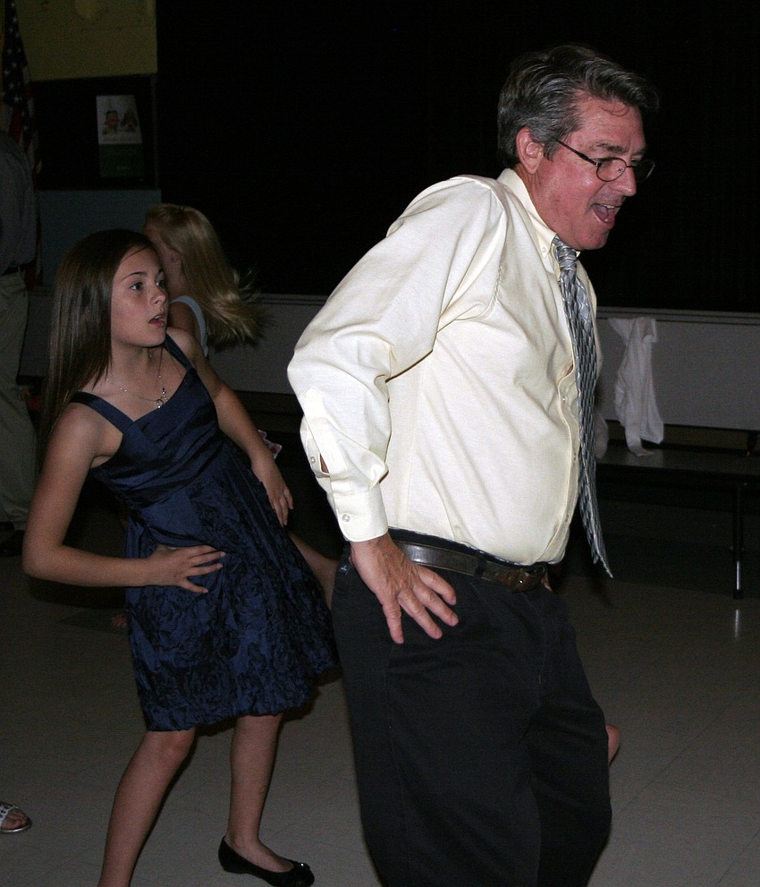 Bruce Macleod showed off his dance moves while doing the Macarena with his daughter, Holly, 11.