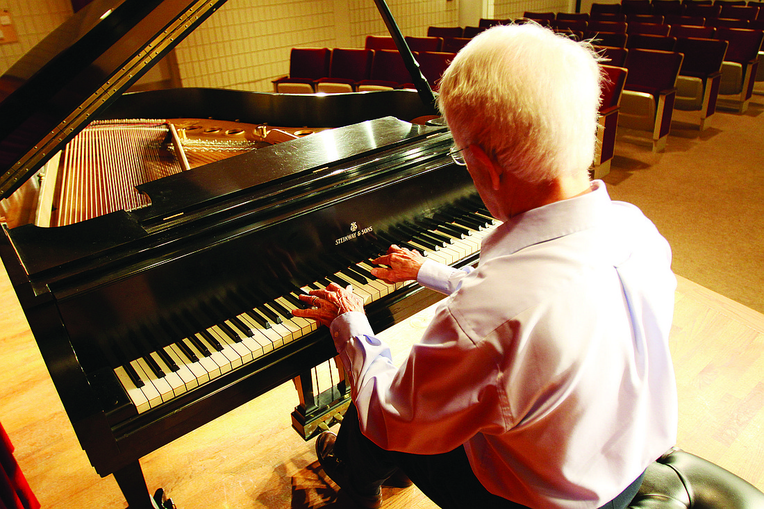Ted Rehl plays the piano he and his wife, Fran, helped Plymouth Harbor buy. Rehl will give his first performance in 19 years Friday, April 1.