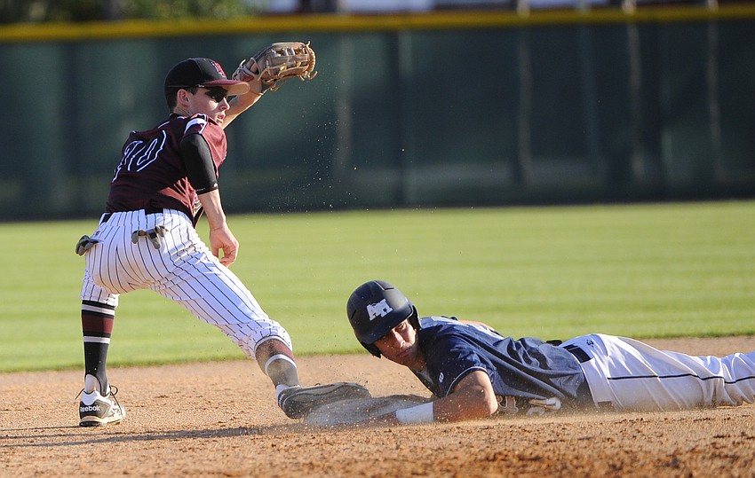 Braden River High shortstop Dalton Busby gets the force out at second base during the Pirates 302 loss to American Heritage Delray March 16.