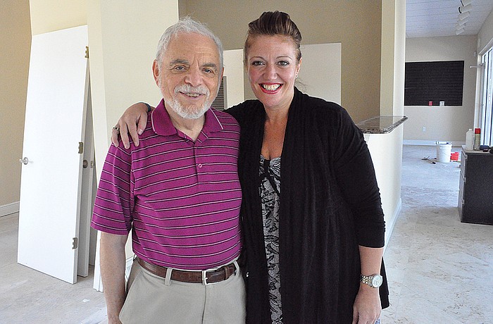 "We can't say how grateful we are (to those who have helped us)," said Humane Society of Lakewood Ranch President Autumn Solomon, pictured with Lake Osprey Village owner Norman Ferber, who donated retail space to the organization for a year.