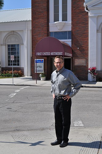 The Rev. Arthur McClellan stands in front of the Pineapple Avenue entrance, which will have glass doors and new canopies after it is remodeled to be more identifiable and welcoming to passersby.