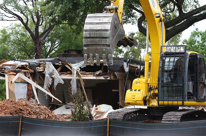 Crews began tearing down the home at 2525 Ringling Blvd. Monday morning.