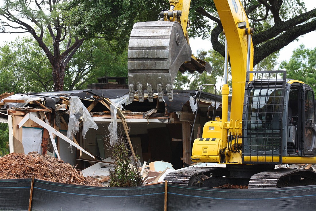 Crews began tearing down the home at 2525 Ringling Blvd. Monday morning.
