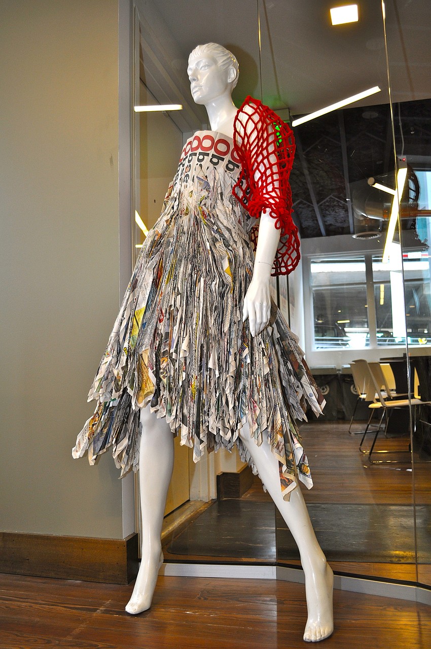 The mannequin sporting the dress sure could use a pair of red stilettos â€”Â size seven-and-a-half.