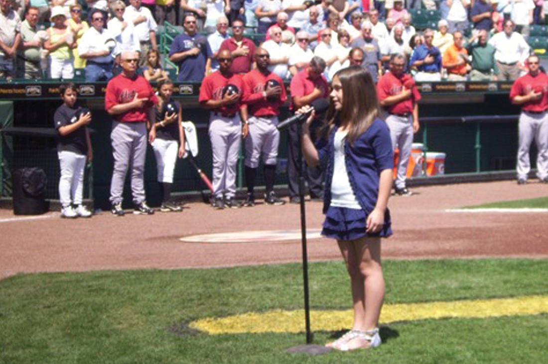About 10,000 baseball fans saw Julia Gennocro perform.