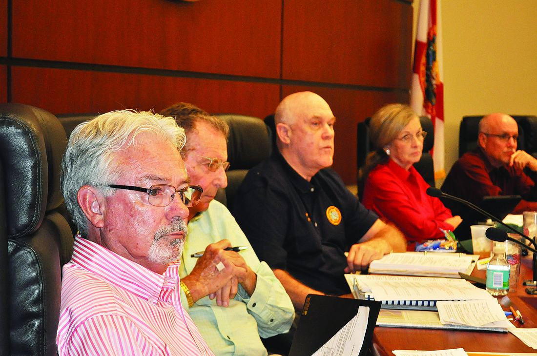 Photos by Dora Walters Newly appointed Longboat Key Mayor Jim Brown, left, and Vice Mayor David Brenner, second from left, presided over their first official regular workshop Thursday, March 24.
