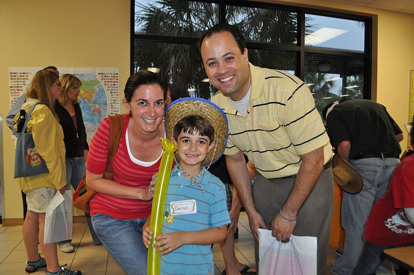 Kindergartener Daron Nouri is all smiles with his mom, Rebekah, and dad, Bejan.