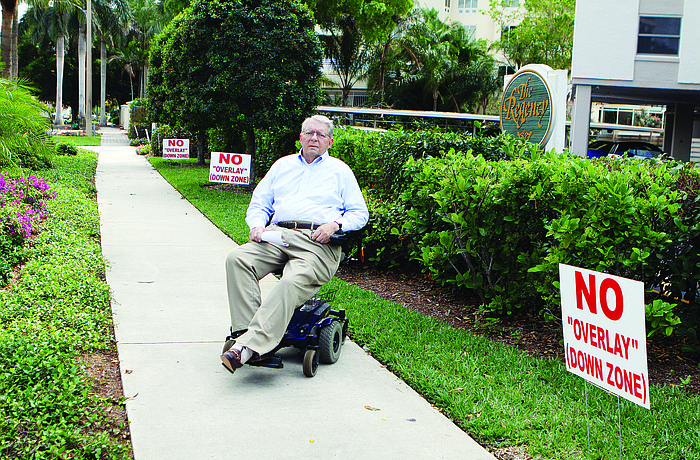 The Regency House displays signs opposing the proposed South Palm overlay district. Crome Dollase, board president of the Regency House, said an overlay would equate to a "taking of residents' property."