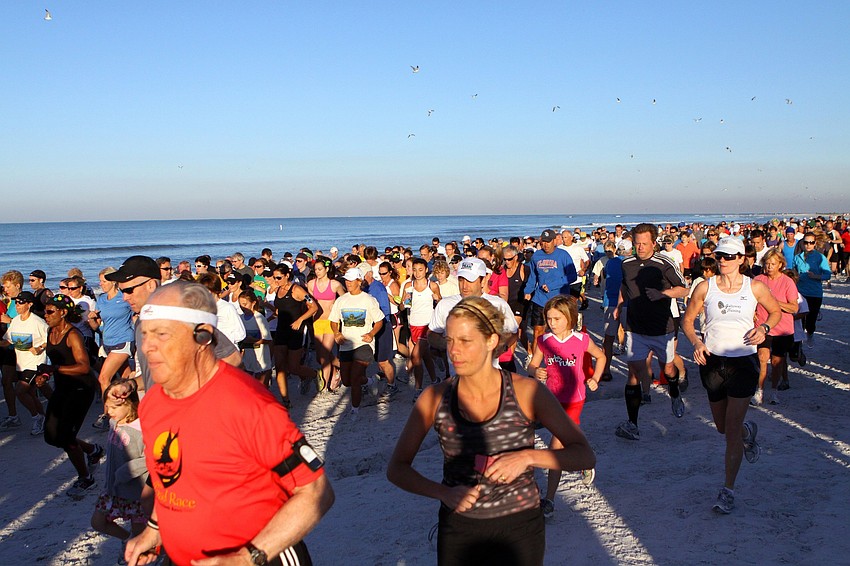 Runners make their way down the beach on Saturday, April 2 during the 25th Annual Run for the Turtles on Siesta Key Beach.