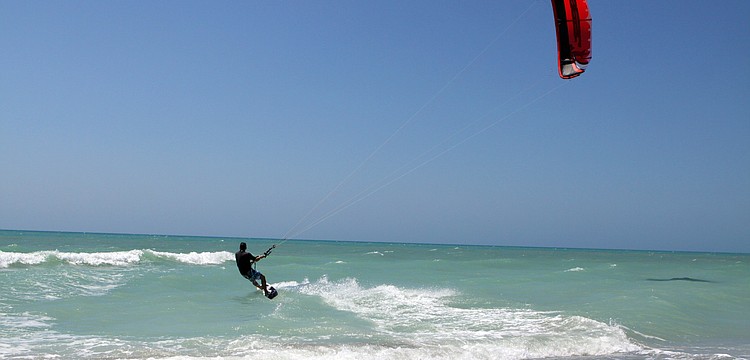 Tony Grinnell welcomed the choppy waves and wind Monday, April 4 as he kitesurfed in the Gulf of Mexico.