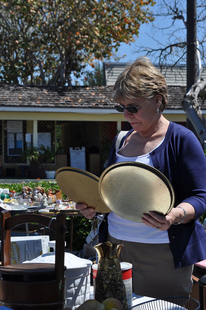 It's decision time for Ann Hilliard looking at a couple of small trays.