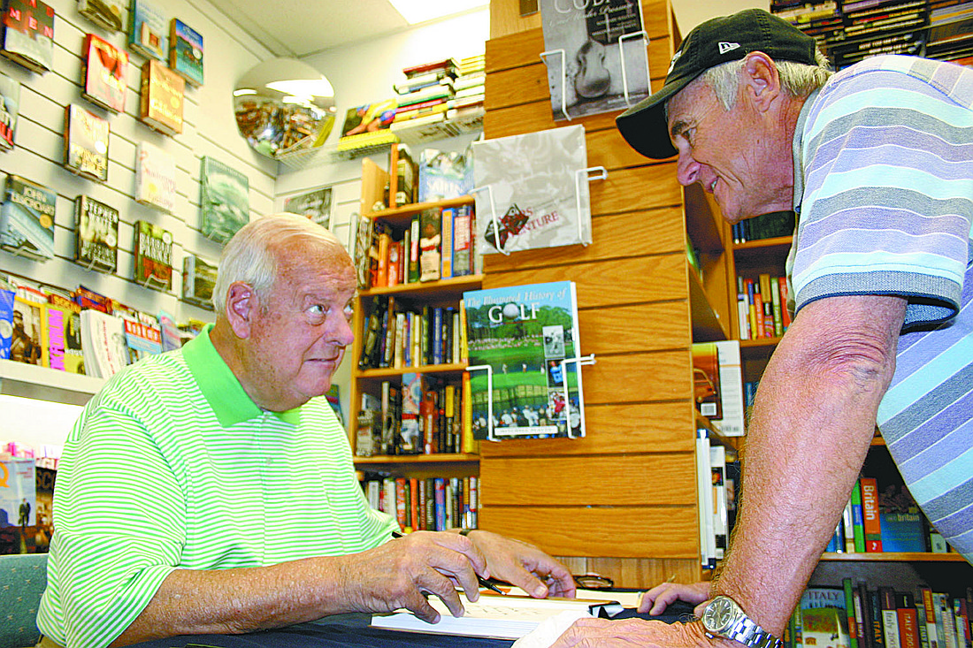 Lou Gorman autographs a copy of his book, "One Pitch From Glory," in 2005 at Circle Books, on St. Armands Circle.