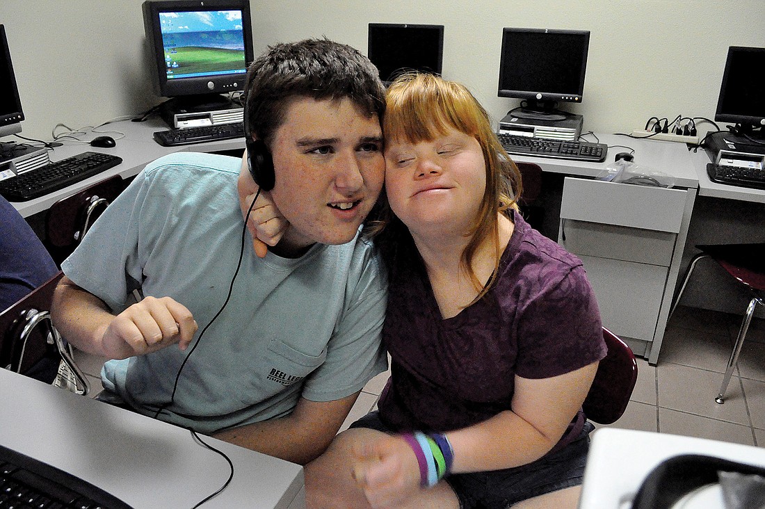 Autistic student Paul Smith, who turns 18 in July, and his sister Michelle, 16, both attend Pinnacle Academy in Lakewood Ranch.