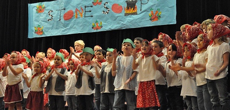 The chorus sings the overture, "Stone Soup."