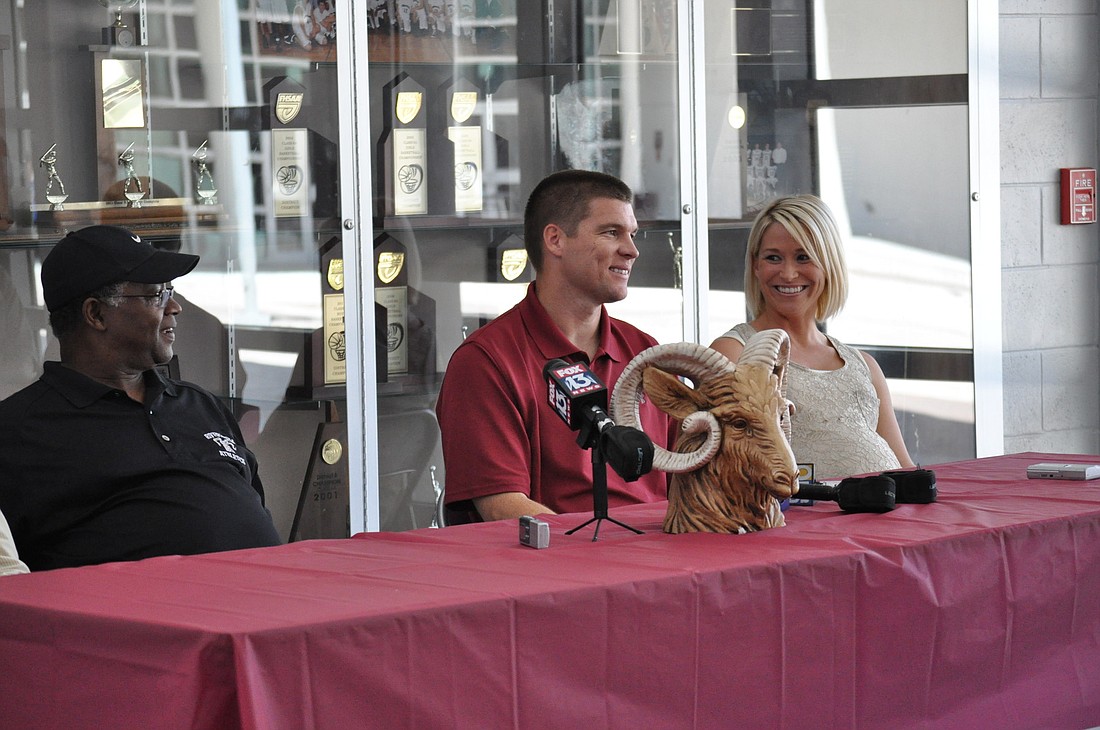 Jim Ward and Todd and Shannon Johnson at a press conference held Wednesday, April 6.