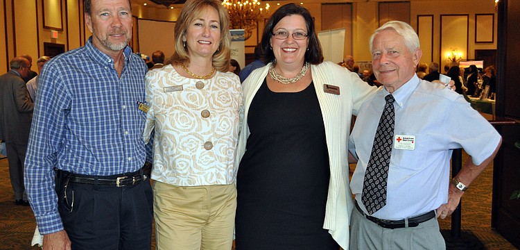Bob and Leigh Simons, LWRBA President Bobbi Larson and Tom Badger enjoyed mingling with other business professionals.