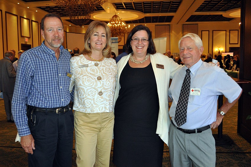 Bob and Leigh Simons, LWRBA President Bobbi Larson and Tom Badger enjoyed mingling with other business professionals.