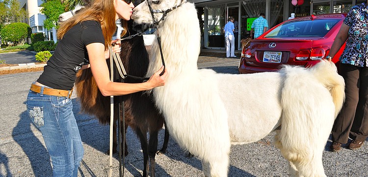 Karli Wilbanks gives Paintball Pete a kiss.
