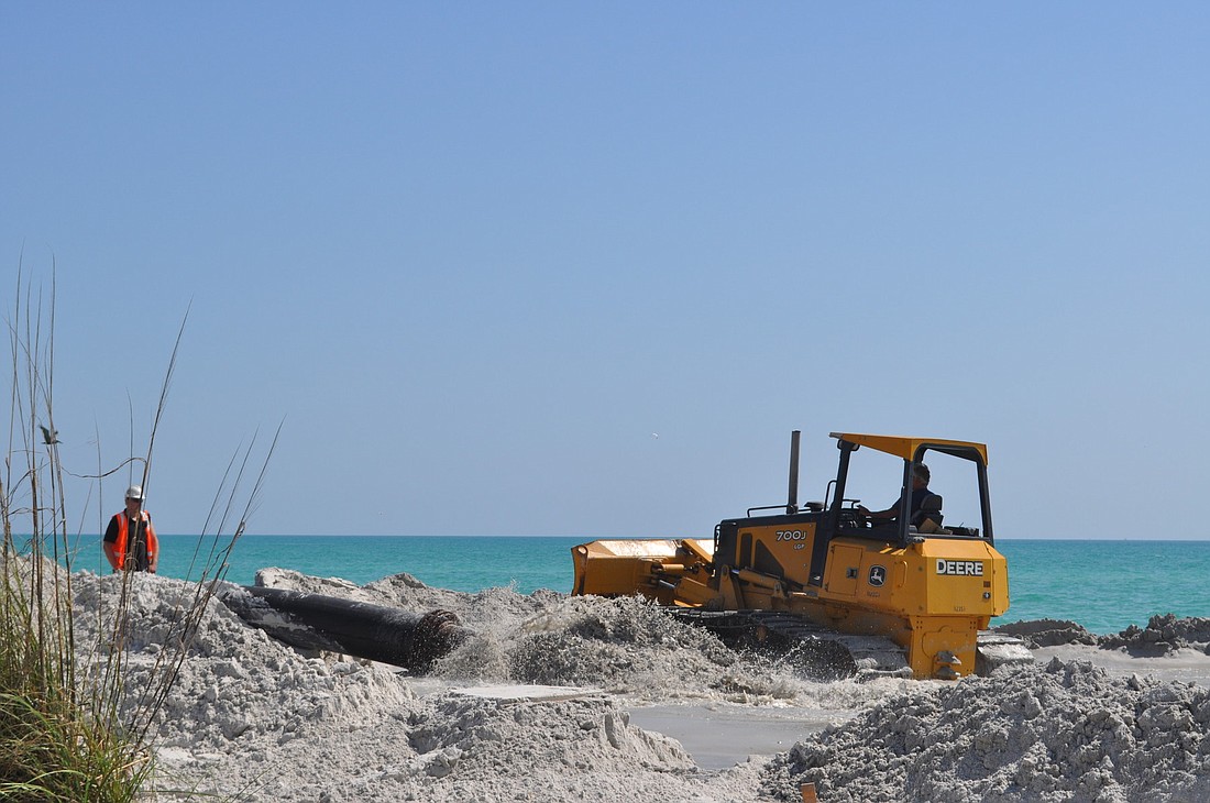 Sand is being pumped onto the north end of the island this week.