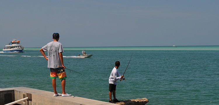 Sarasota Military Academy students Nick Hallorn and A.J. Robman spent the day fishing on Siesta Key.