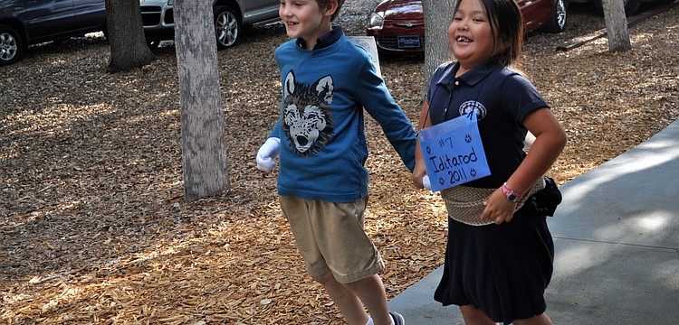 Grady Paxton and Madeline Kwan hopped around campus during Out-of-Door Academy's iditarod race.