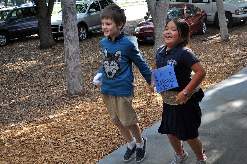 Grady Paxton and Madeline Kwan hopped around campus during Out-of-Door Academy's iditarod race.
