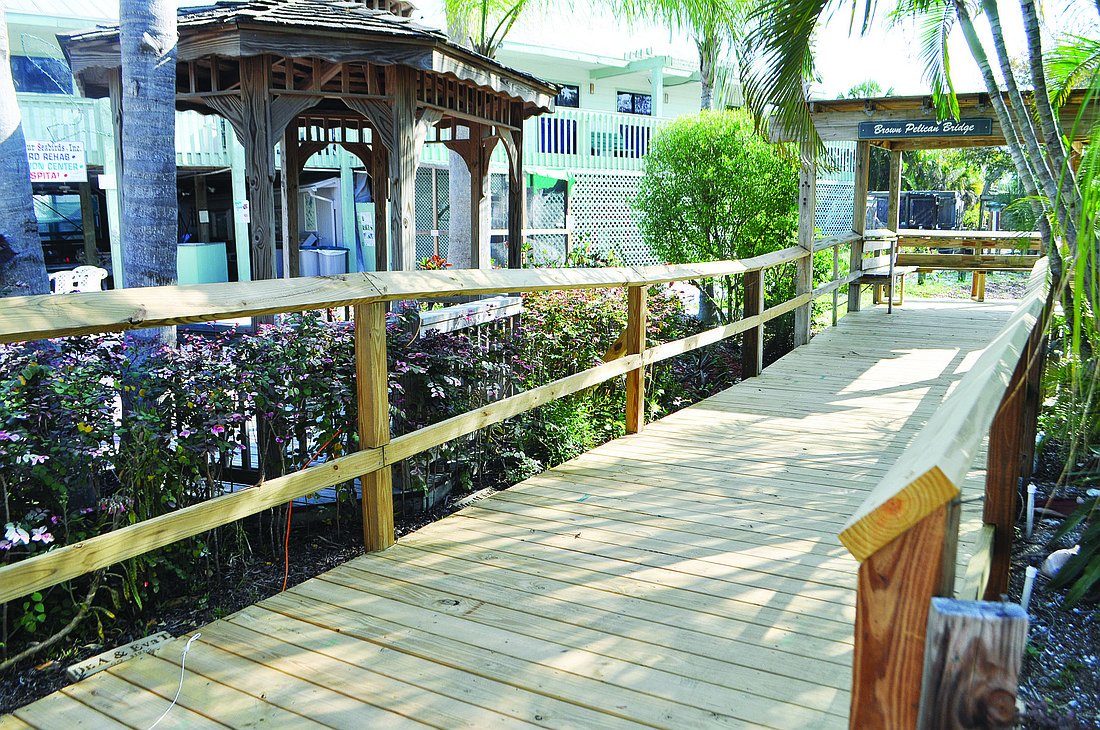 The newly renovated boardwalk features benches so that visitors can sit in the shade and enjoy the birds.