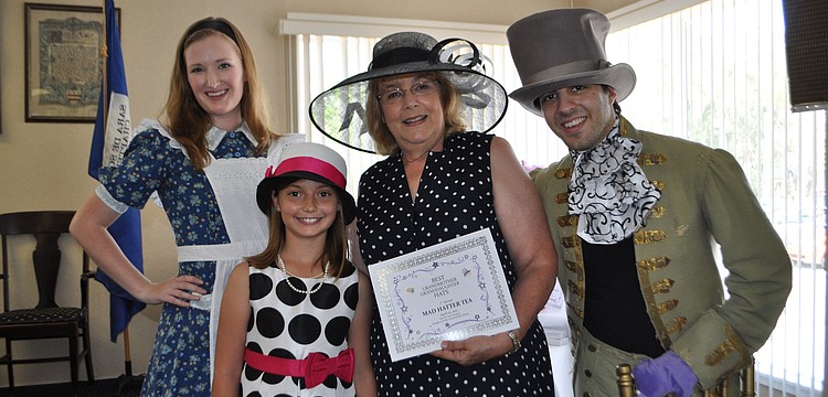 Alicia Dawn Bullen, as Alice; Best Grandmother and Granddaughter Pair winners, Mia and Rhoda Garcia; and Ron Kagan as the Mad Hatter.
