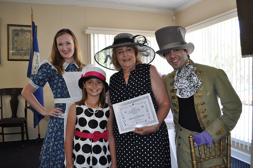 Alicia Dawn Bullen, as Alice; Best Grandmother and Granddaughter Pair winners, Mia and Rhoda Garcia; and Ron Kagan as the Mad Hatter.