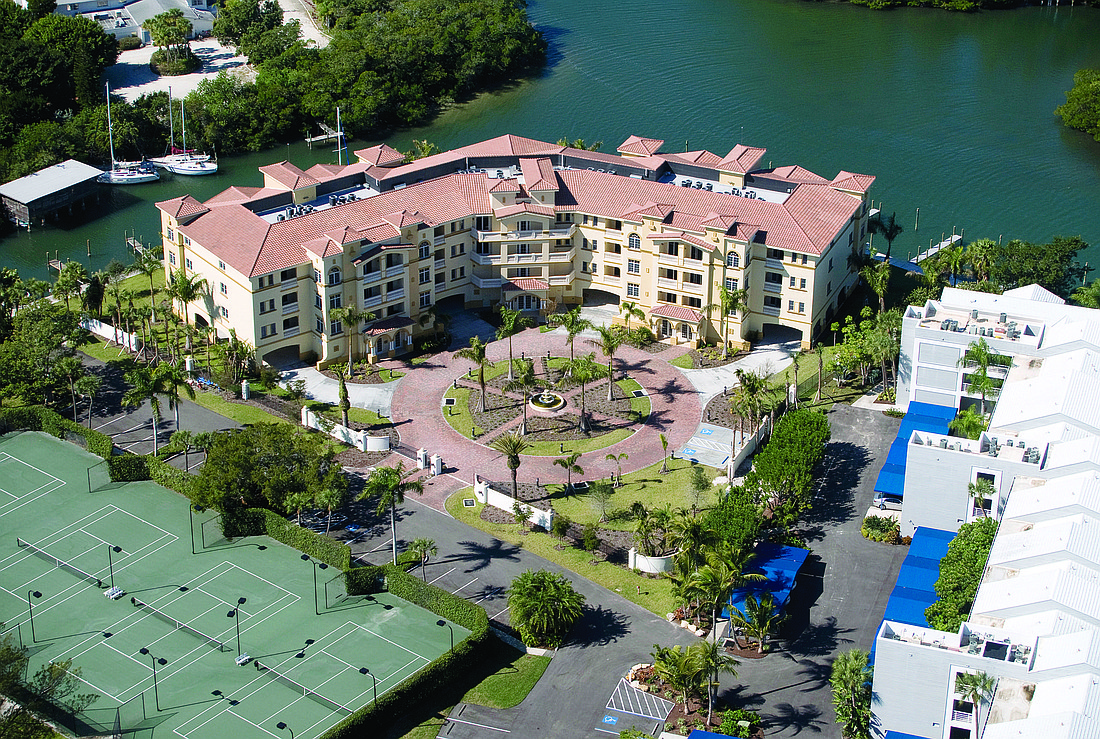The Grand Mariner development includes 14 condominiums and 20 deep-water boat slips.